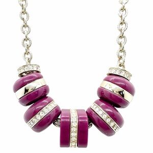 Loft necklace with rhinestones in purple hoops on a silver-tone pendant.